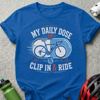 Blue t-shirt with "My Daily Dose" and "Clip In & Ride" text and bicycle graphic.
