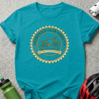 Teal t-shirt with a circular bicycle graphic: "Certified Gear Addict Est. When I Got My First Carbon Bike".