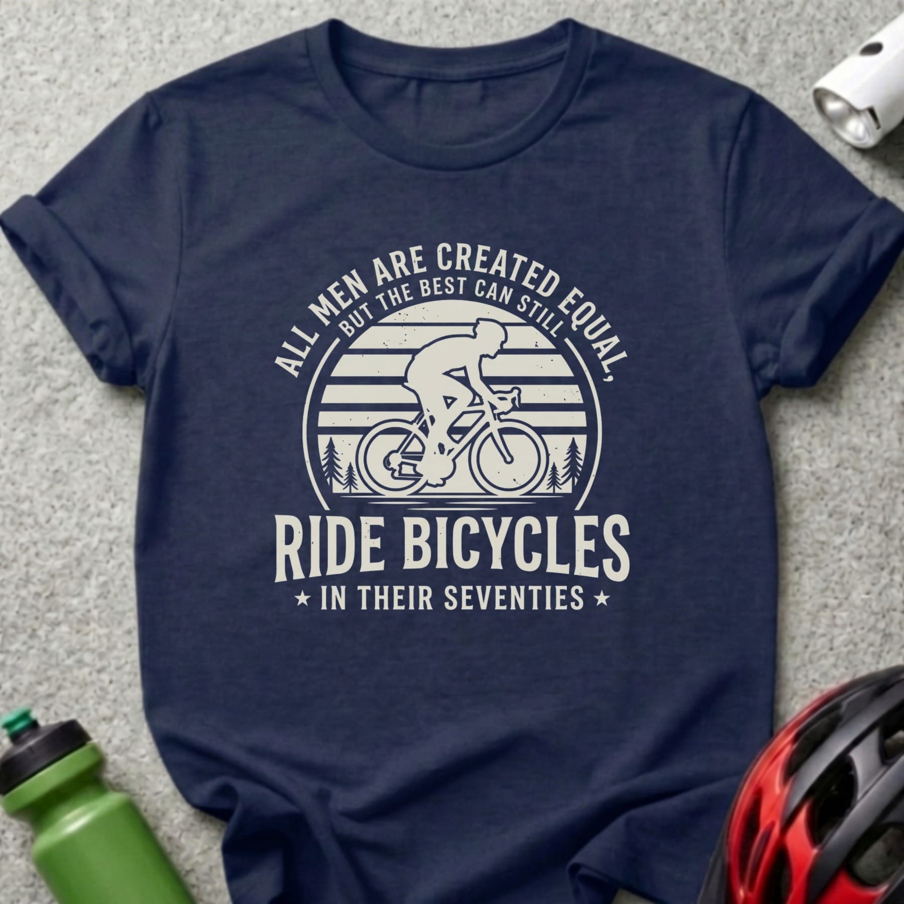 Dark blue t-shirt with "All men are created equal but the best can still ride bicycles in their seventies" text.