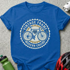 Blue t-shirt with vintage bicycle and "Vintage Frame Modern Engine" text.
