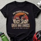T-shirt with cyclist, piggy bank, and text "Bad Financial Decisions, Great Bike Choices."