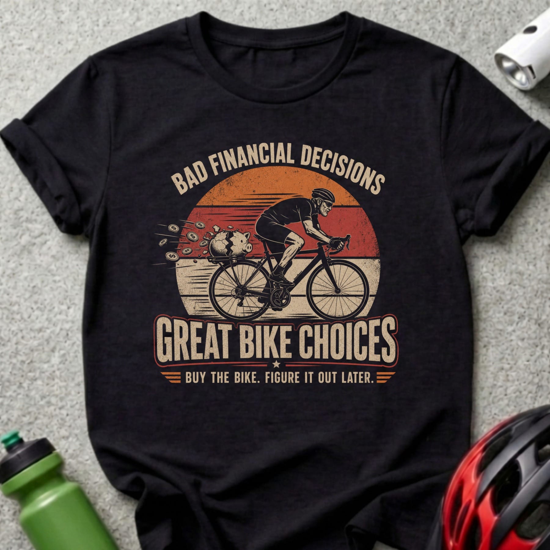 T-shirt with cyclist, piggy bank, and text "Bad Financial Decisions, Great Bike Choices."