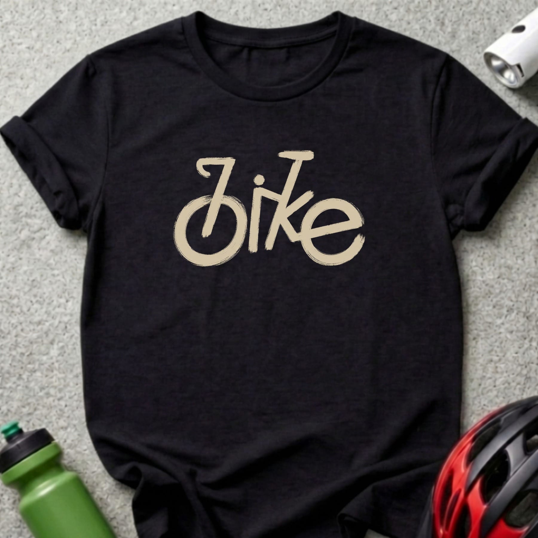 Black t-shirt with a beige brushstroke "bike" graphic and cycling accessories.