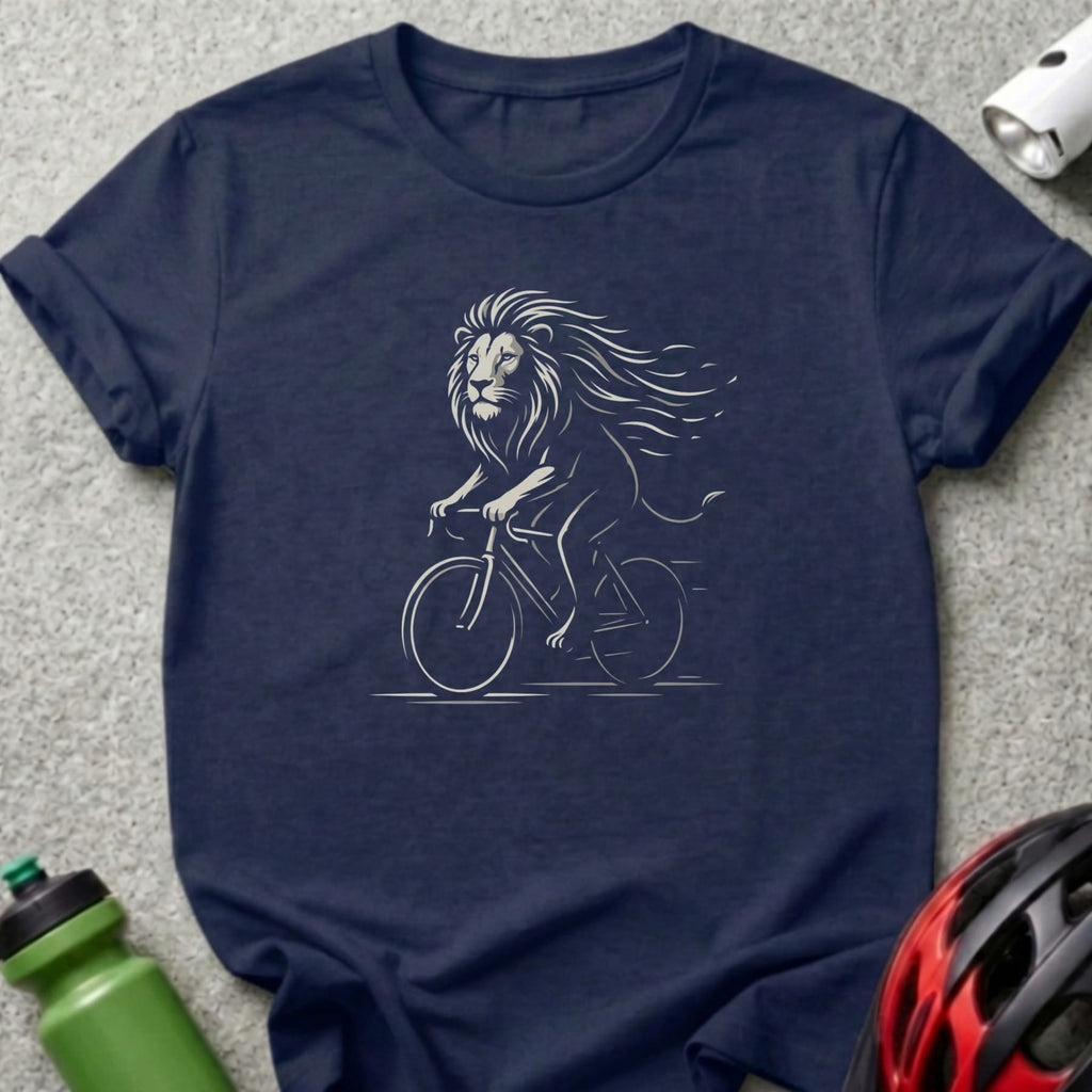 Lion riding a bicycle in a white line drawing on a navy t-shirt.