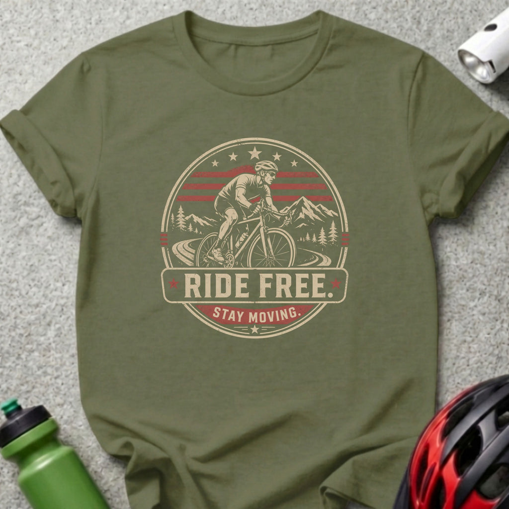 Green t-shirt with circular graphic of cyclist, mountains, and text "RIDE FREE. STAY MOVING."
