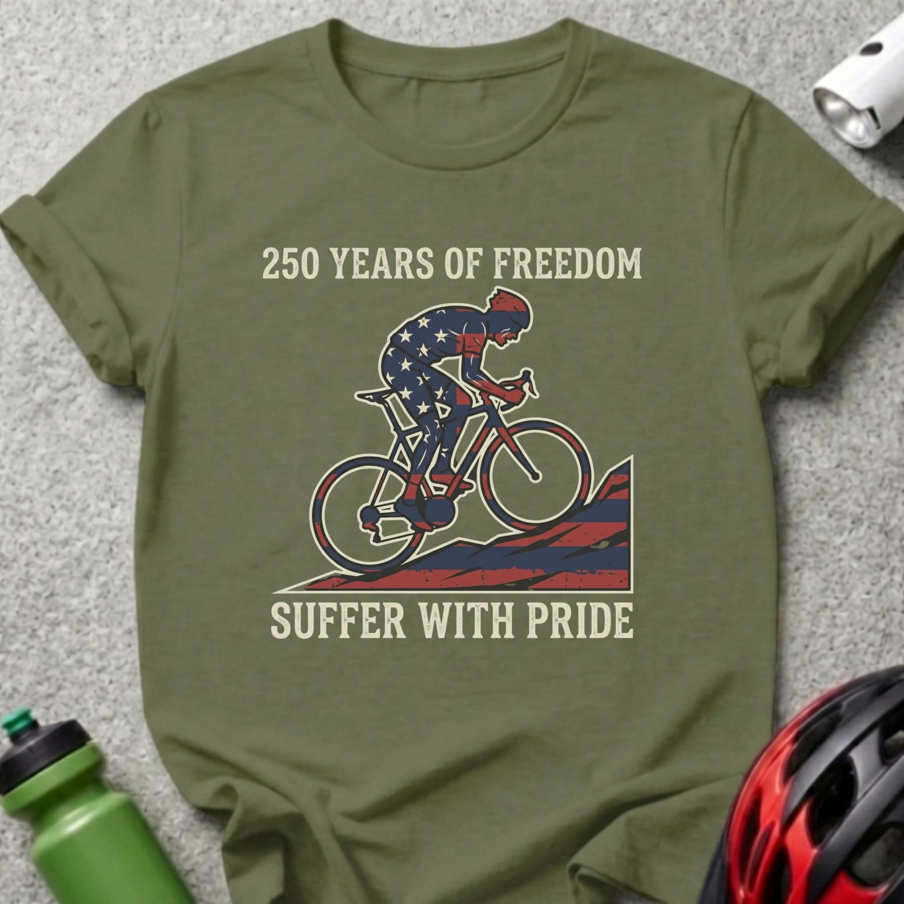 Olive t-shirt with cyclist graphic and "250 YEARS OF FREEDOM SUFFER WITH PRIDE" text.