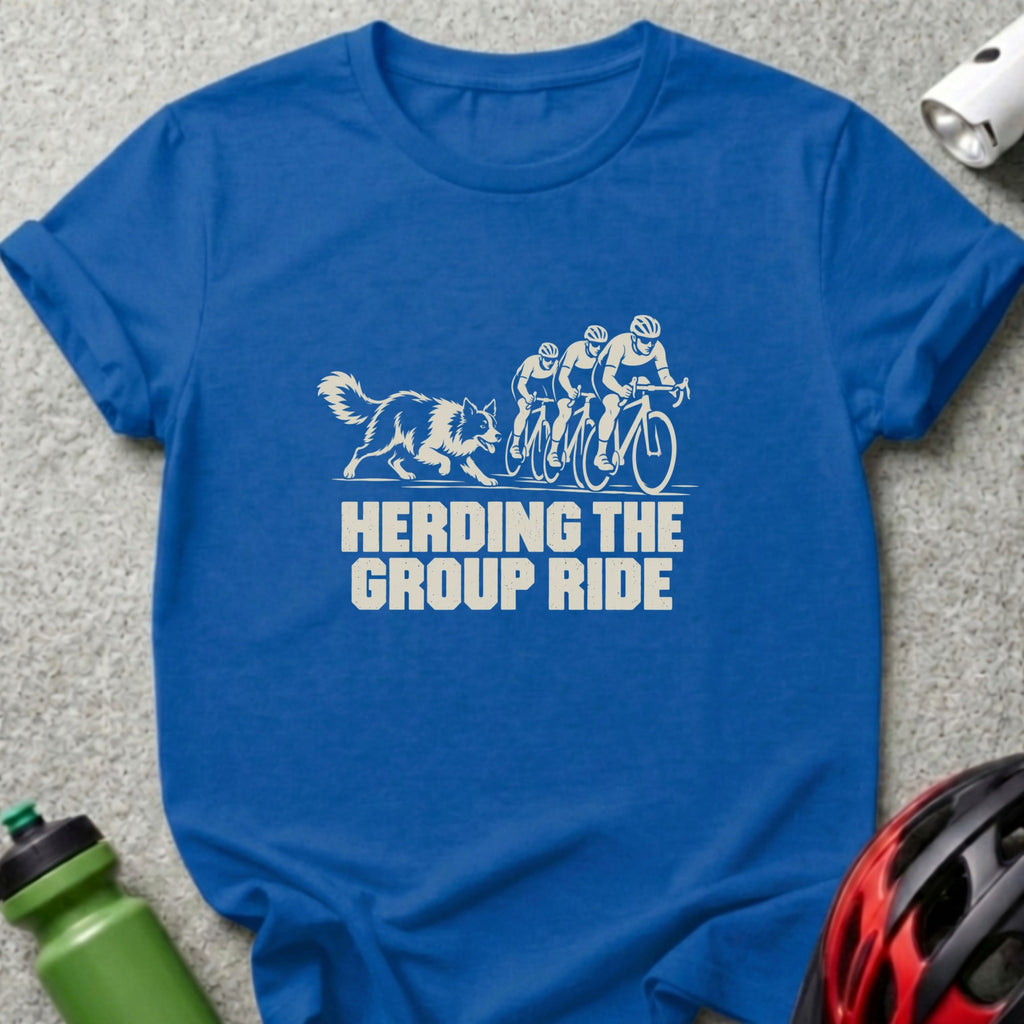 Royal blue t-shirt featuring a white graphic of three cyclists and a dog with text reading HERDING THE GROUP RIDE.