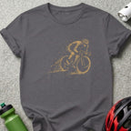 Charcoal t-shirt with a gold dotted cyclist graphic and a red and black helmet.