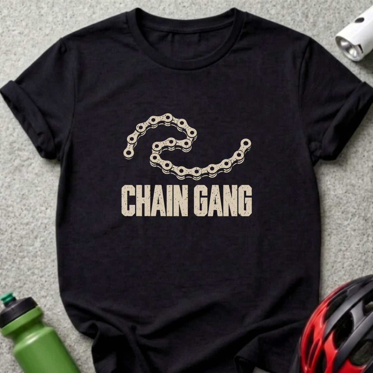 A black short-sleeved t-shirt features a distressed graphic of a bicycle chain and the text "CHAIN GANG."