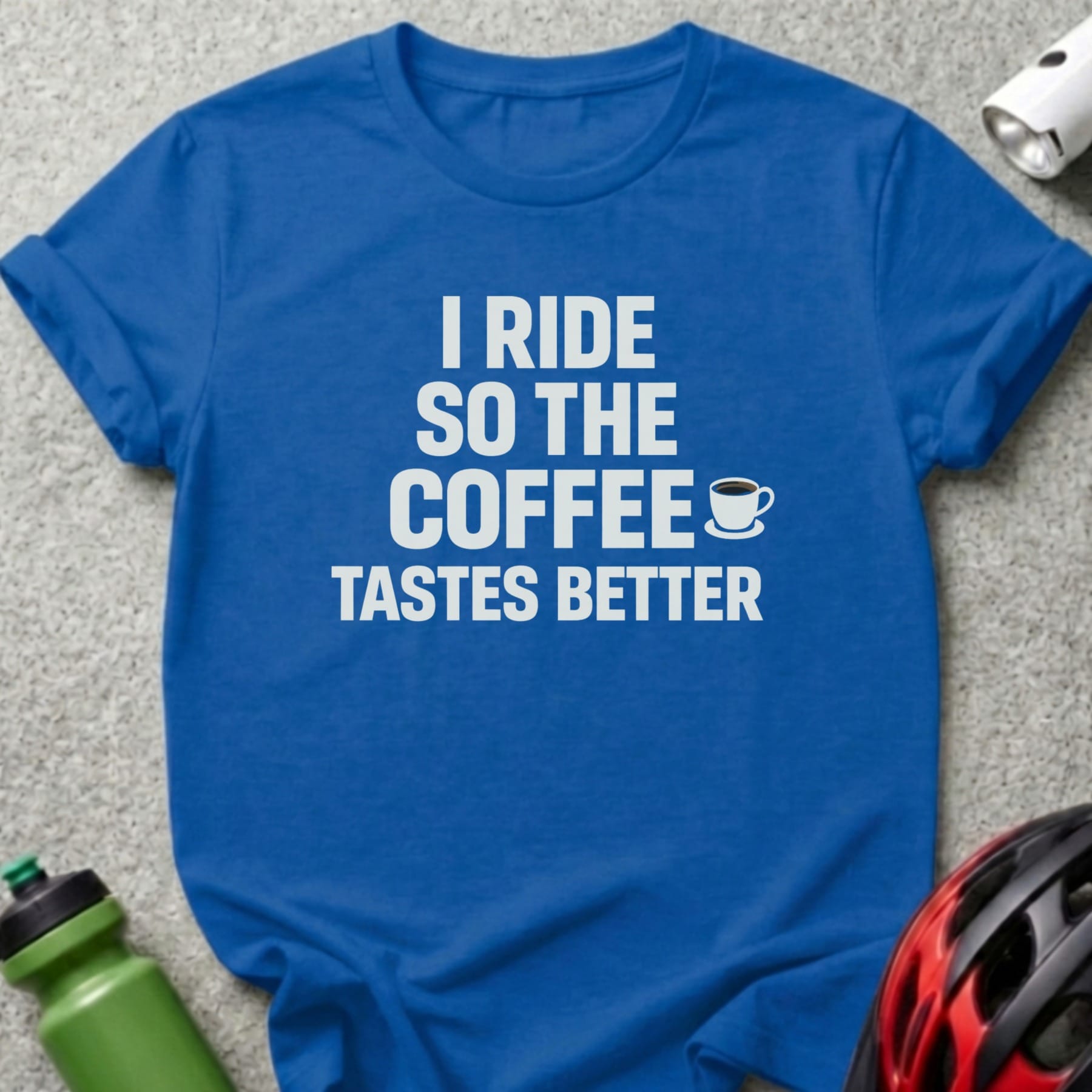 Blue t-shirt with white text "I RIDE SO THE COFFEE TASTES BETTER".