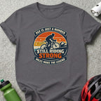 Grey t-shirt with "Age is just a number, still riding strong" and cyclist graphic.