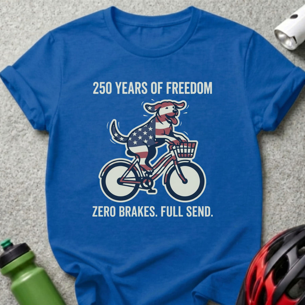 Blue t-shirt with dog on bicycle, "250 Years of Freedom. Zero Brakes. Full Send."