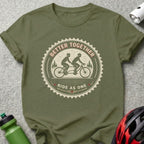 Olive green t-shirt with "Better Together Ride As One" tandem biking graphic.