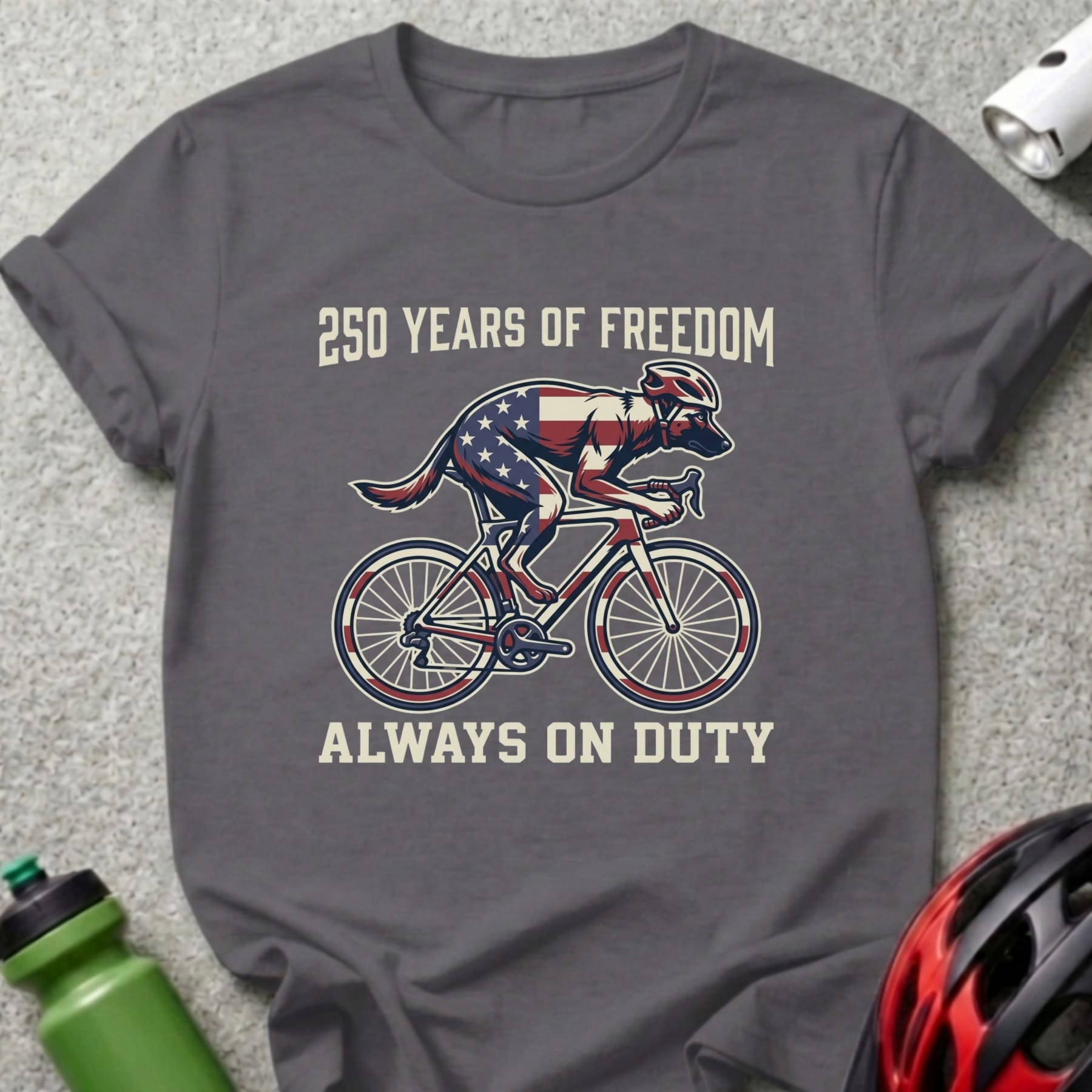 Gray t-shirt with a dog on a bicycle, American flag design, and text.