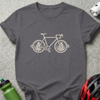 Dark gray short-sleeved t-shirt featuring a white graphic of a bicycle with latte art wheels.