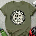 Olive green t-shirt with "Eat Sleep Ride Repeat" bicycle gear graphic.