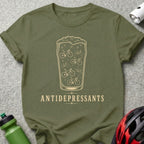 Olive t-shirt with glass of beer featuring bicycle silhouettes and "ANTIDEPRESSANTS" text.