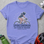 T-shirt with a woman on a bicycle, American flag design, "Spokeswoman 250 Years of Freedom".
