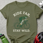Green t-shirt with cyclist graphic and text "RIDE FAR. STAY WILD."