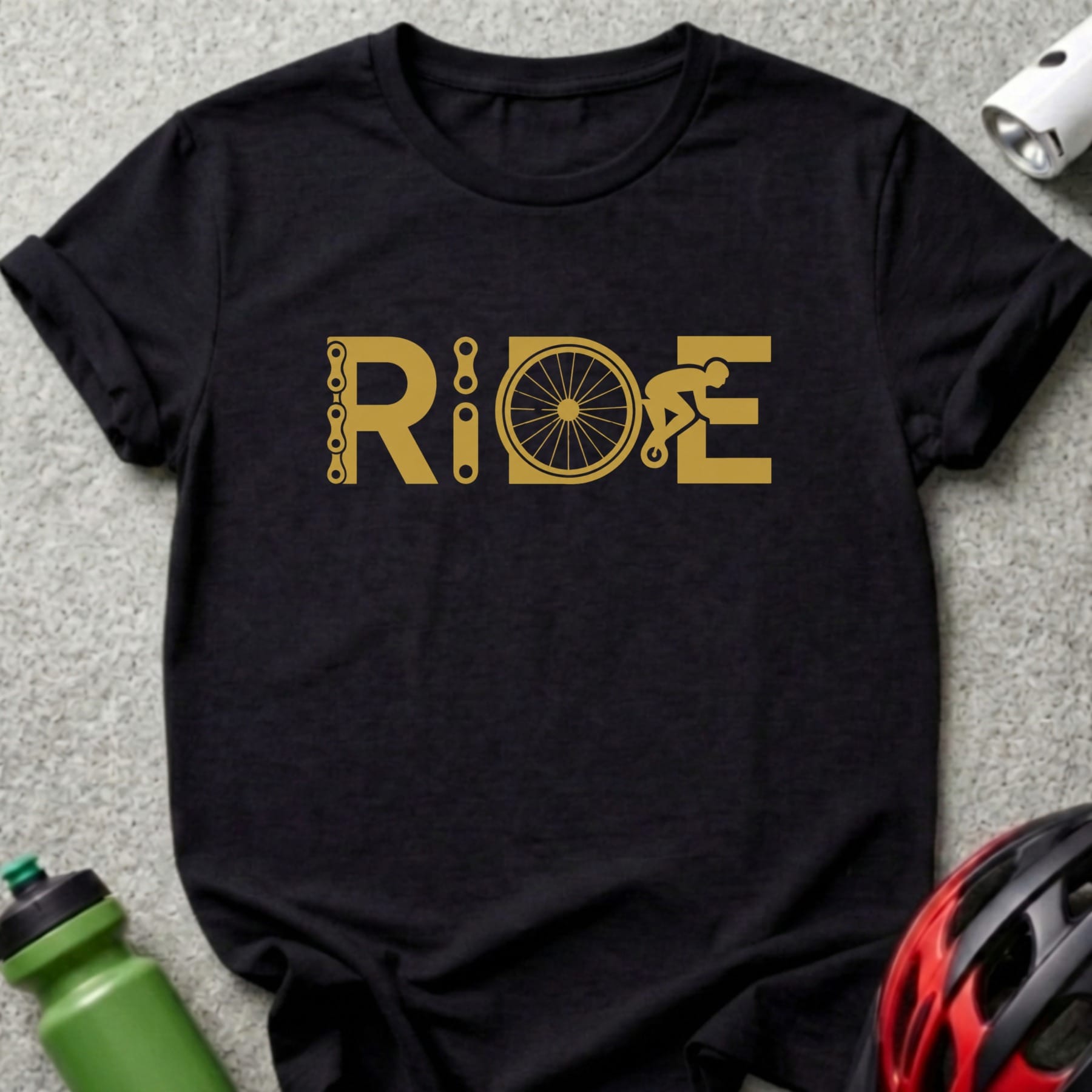 Black t-shirt with gold graphic that spells out "RIDE" with bicycle elements.