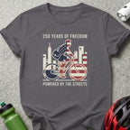 T-shirt with cyclist graphic, cityscape, and "250 Years of Freedom" text.