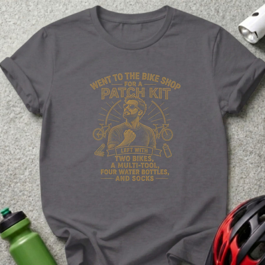 Grey t-shirt with orange dotted text about shopping for a patch kit.