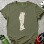 Olive green t-shirt with graphic of a leg and bicycle gear on knee.