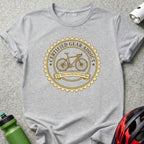 Gray t-shirt with a circular graphic featuring a bicycle and "Certified Gear Addict."