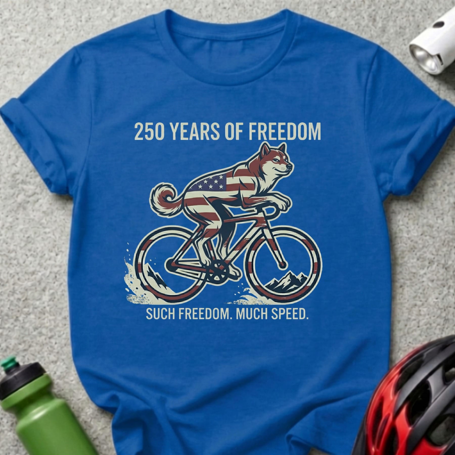 Blue t-shirt with husky dog riding a bicycle, "250 Years of Freedom. Such Freedom. Much Speed."