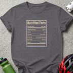 Gray t-shirt with "Nutrition Facts" listing serving size, calories, stress, excuses, fresh air, sore legs, and regret.