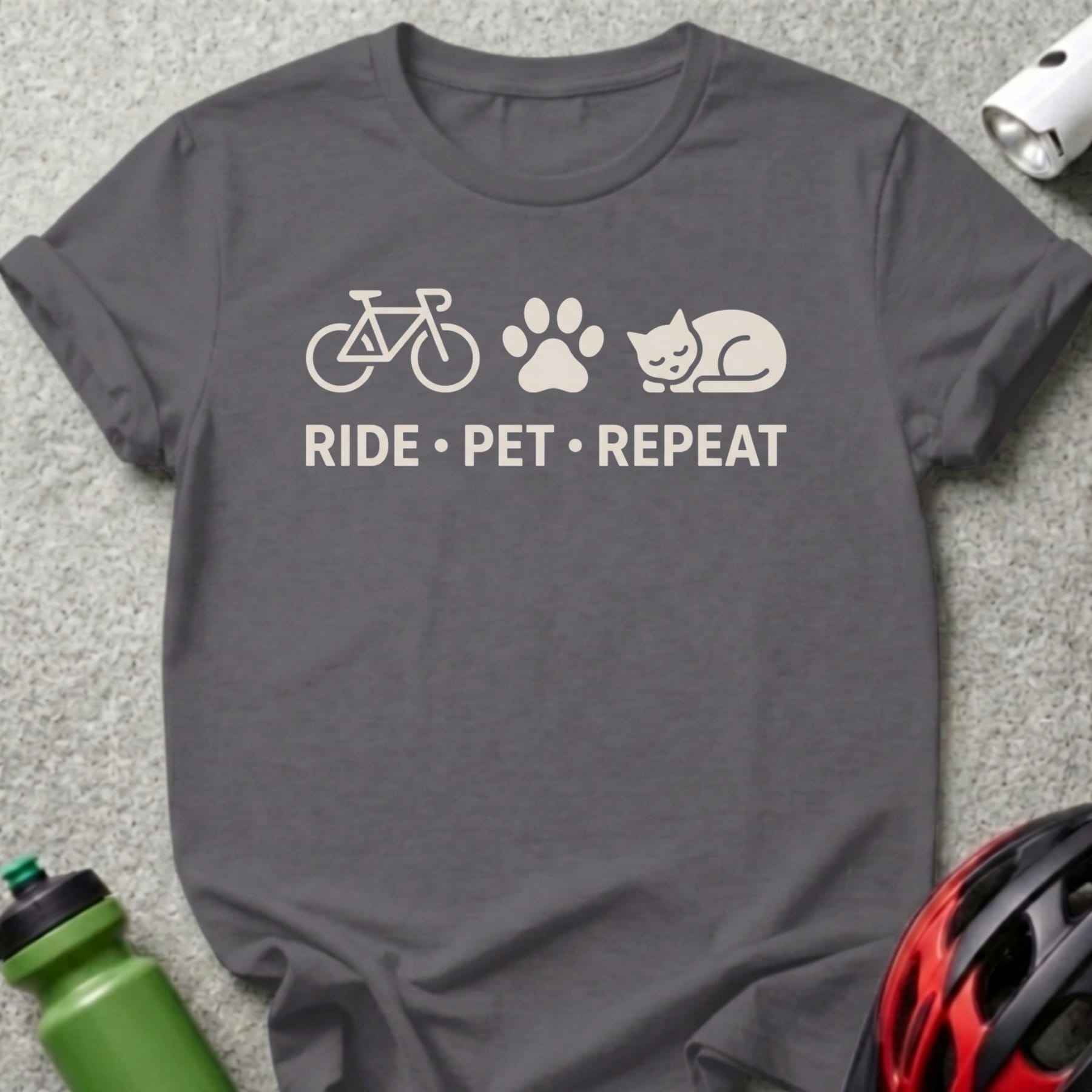 T-shirt with bicycle, paw print, and cat icons, and text "RIDE • PET • REPEAT".
