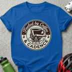 Royal blue t-shirt with "Fueled by Coffee & Cadence" circular logo featuring a coffee cup and bicycle chain.