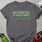 Gray t-shirt with a sign reading "My other car is also a bike 0.0".