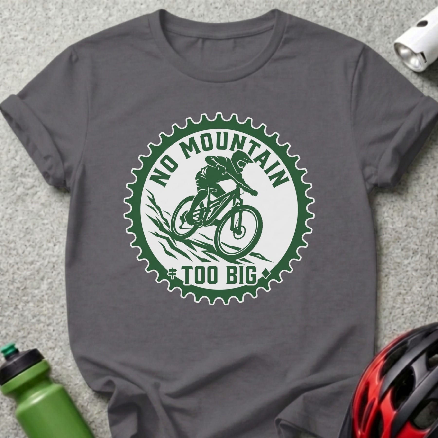 T-shirt with "No Mountain Too Big" text and mountain biker graphic.