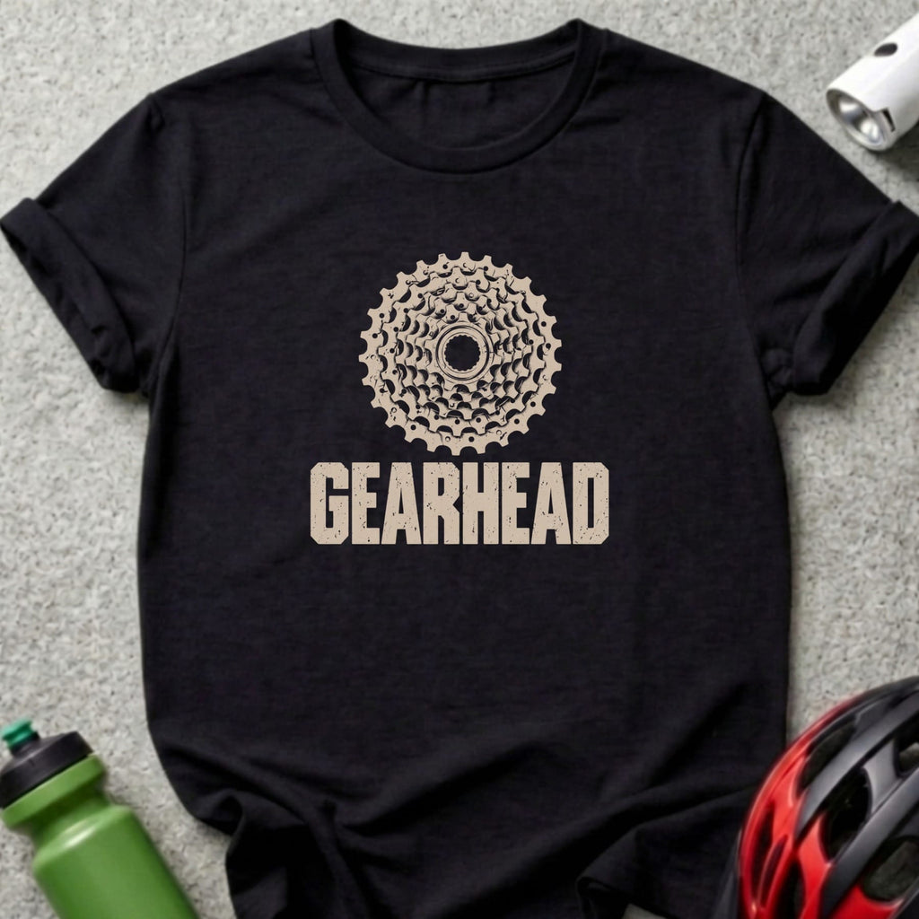 A black short-sleeved t-shirt features a bicycle cassette graphic and the text GEARHEAD in distressed beige letters.