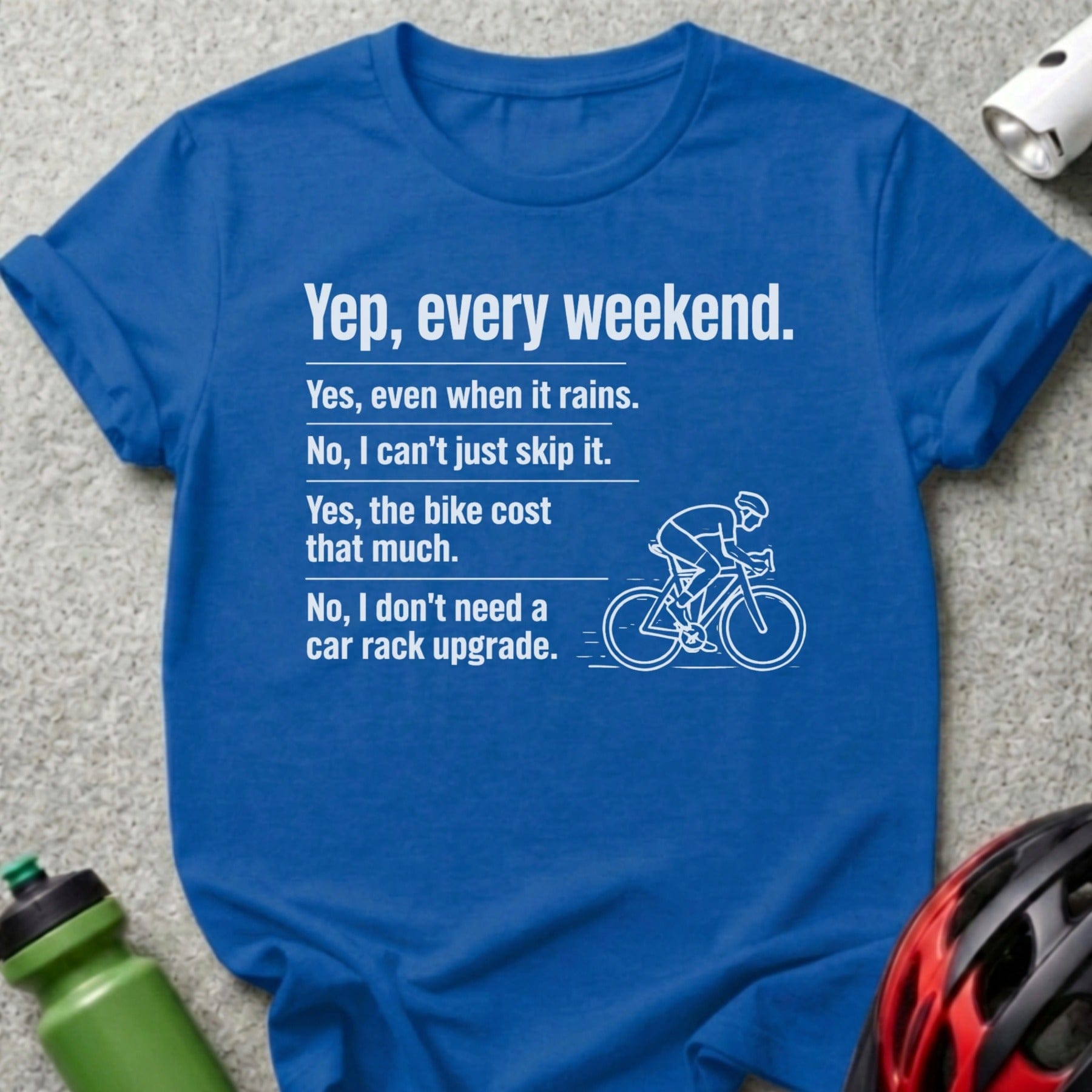 Blue t-shirt with text about cycling and a bicycle illustration.