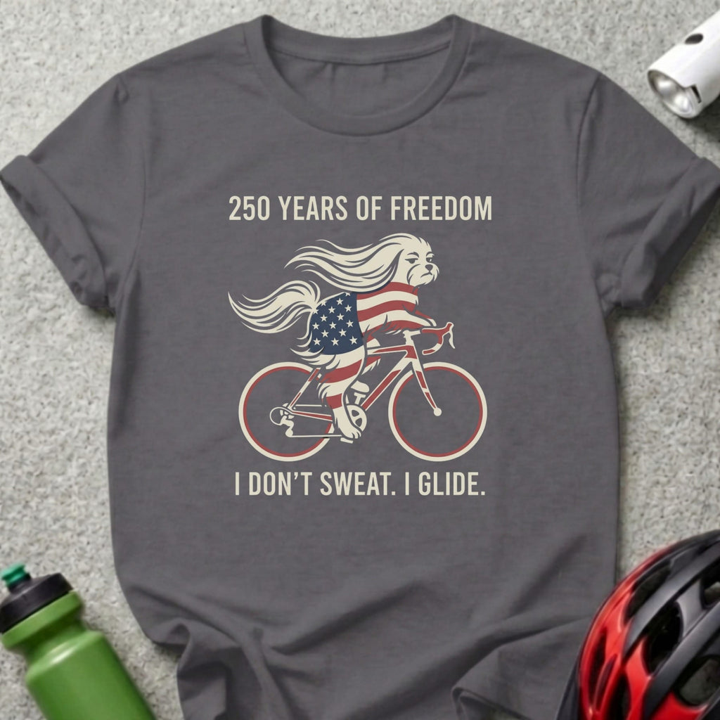 Dog in American flag bandana riding a bicycle, "I DON'T SWEAT. I GLIDE."
