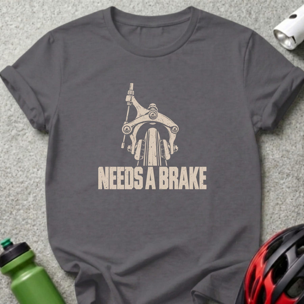 Dark grey t-shirt featuring a distressed vintage graphic of a bicycle brake and the text NEEDS A BRAKE.