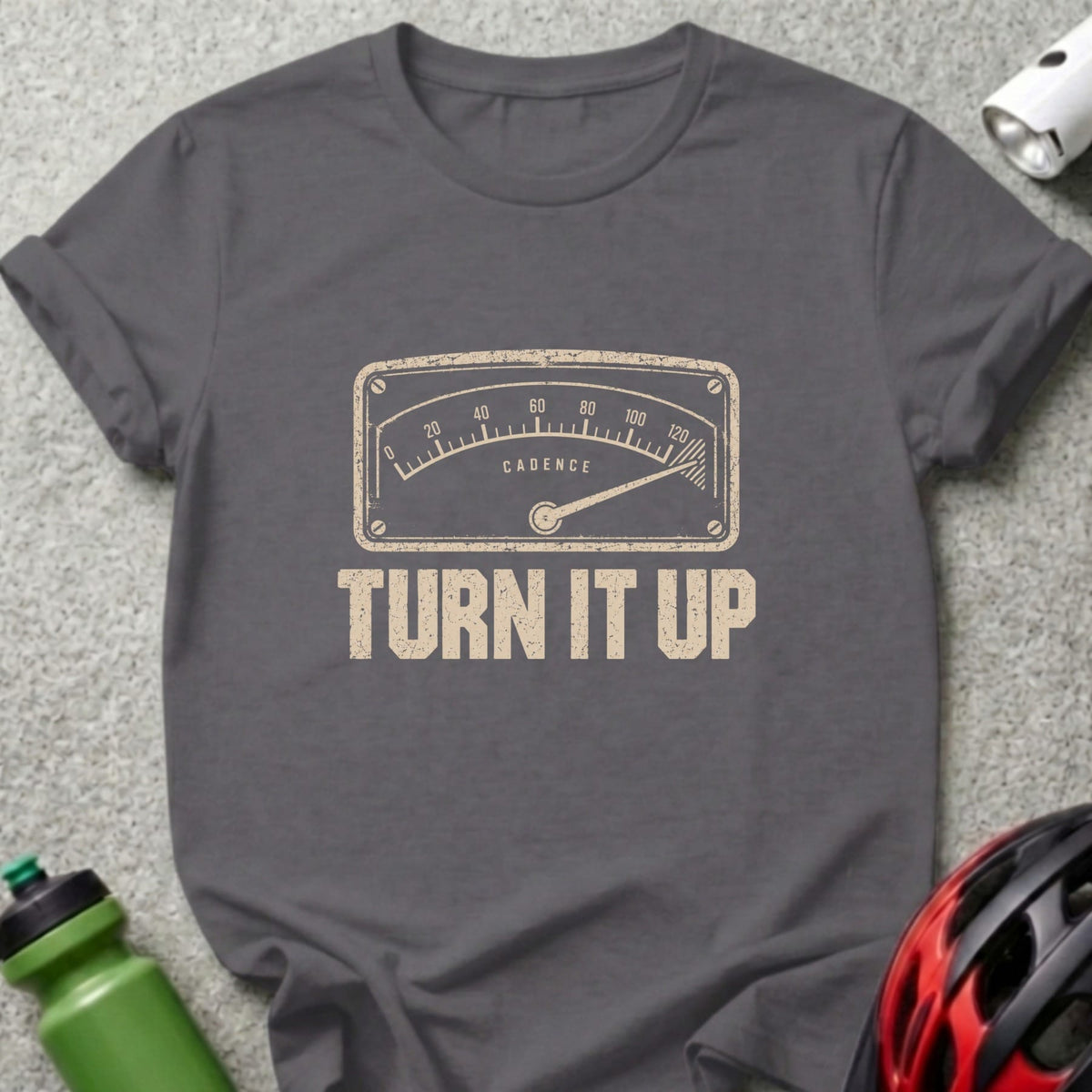 A dark gray crewneck t-shirt featuring a vintage gauge graphic and the text TURN IT UP.