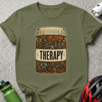 T-shirt graphic: Prescription bottle filled with bicycles, labeled "THERAPY."