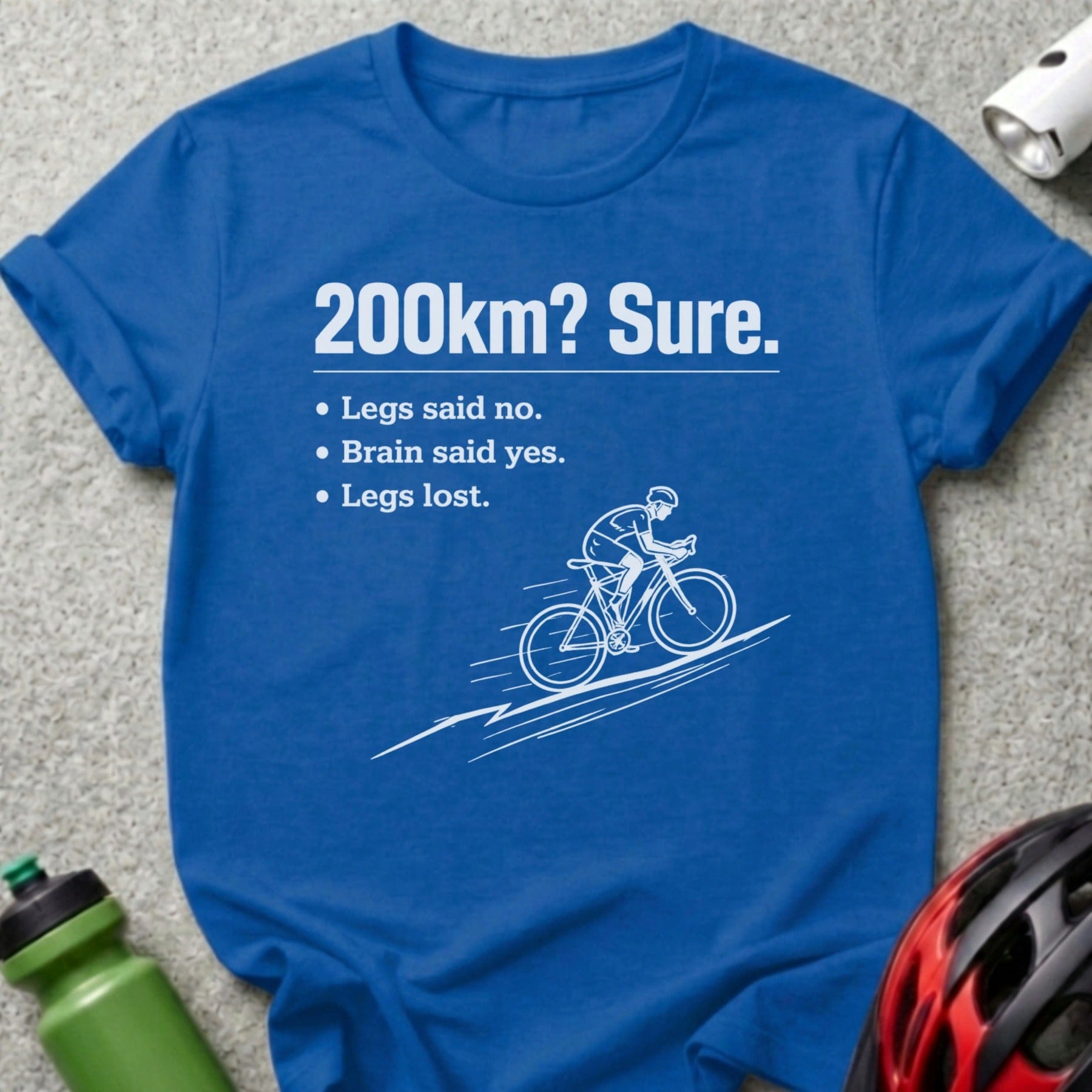 Blue t-shirt with text "200km? Sure." and cyclist graphic.