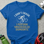 Blue t-shirt with "I don't crash. I perform unscheduled dismounts." text and cyclist graphic.