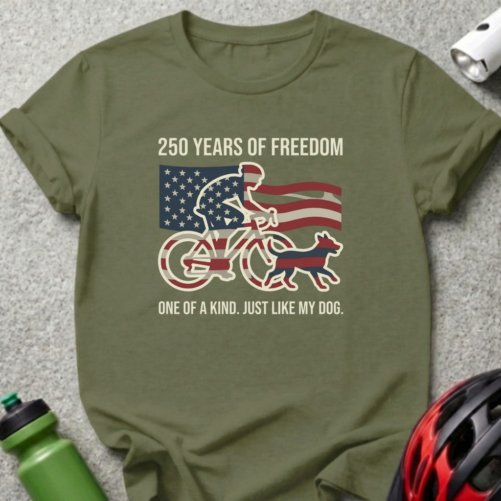 Olive green t-shirt with "250 Years of Freedom" and cyclist with flag, dog.
