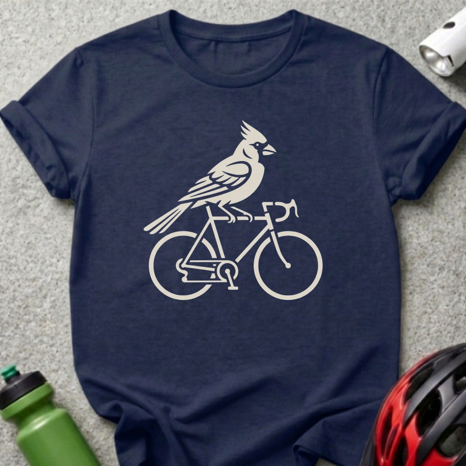 Cardinal silhouette on a bicycle on a navy t-shirt.