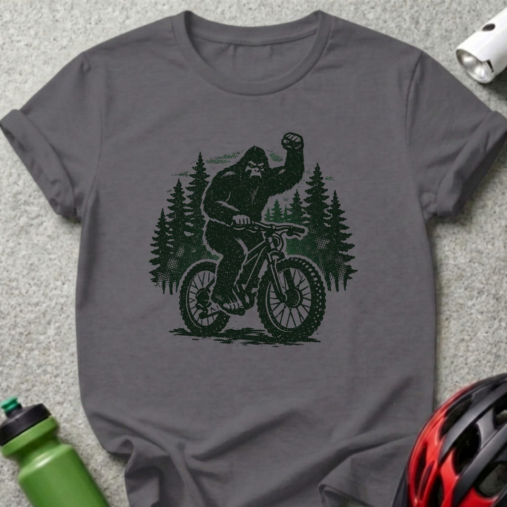 Bigfoot riding a bicycle through a forest.