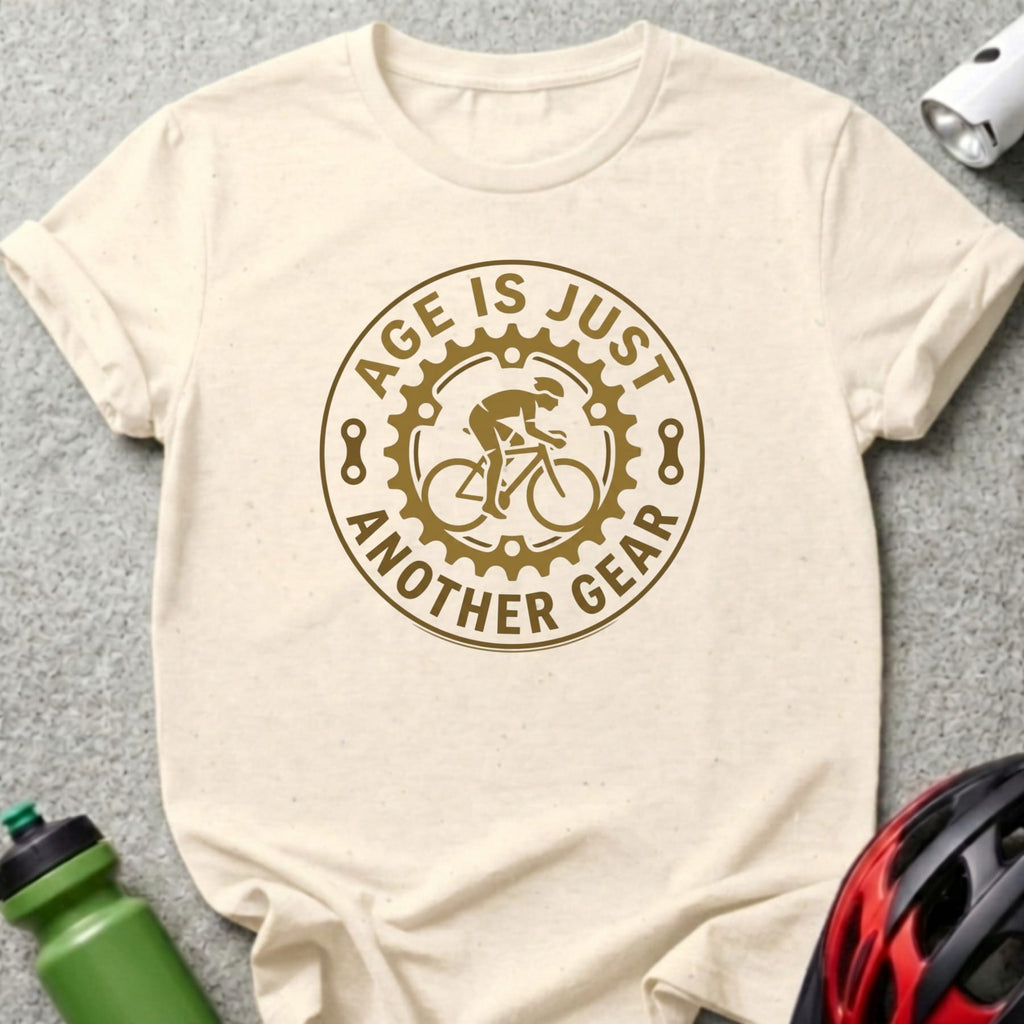Cream t-shirt with "Age is just another gear" text and cyclist graphic.