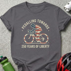 T-shirt graphic: cyclist with American flag, "Pedalling Towards 250 Years of Liberty".