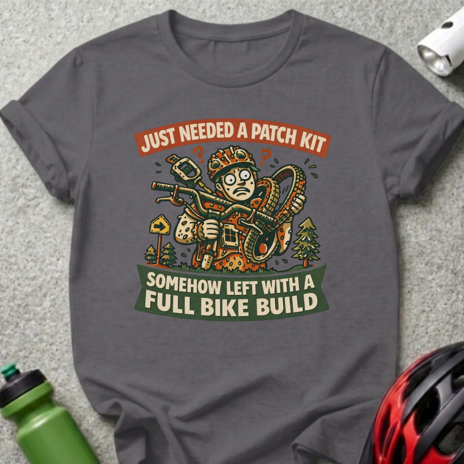 T-shirt graphic: "Just needed a patch kit, somehow left with a full bike build."