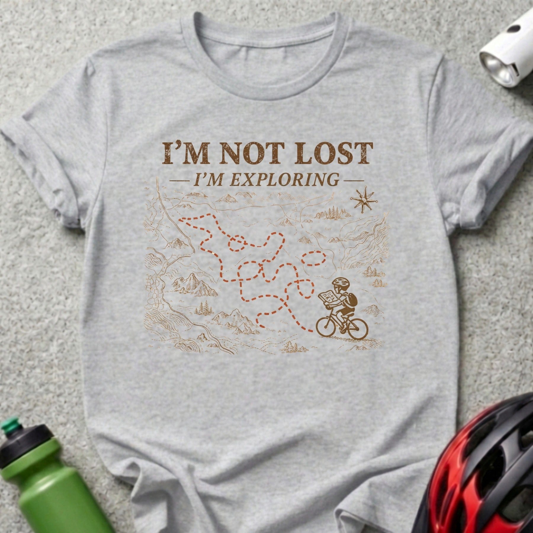 Gray t-shirt with "I'M NOT LOST - I'M EXPLORING" and a cyclist on a map.