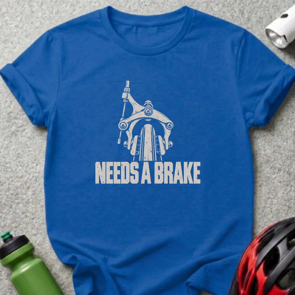 A royal blue t-shirt printed with a vintage bicycle brake and the text Needs a Brake.